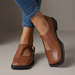 Rosalie light brown leather-look T-strap flats with a square toe.