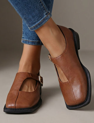 Rosalie light brown leather-look T-strap flats with a square toe.